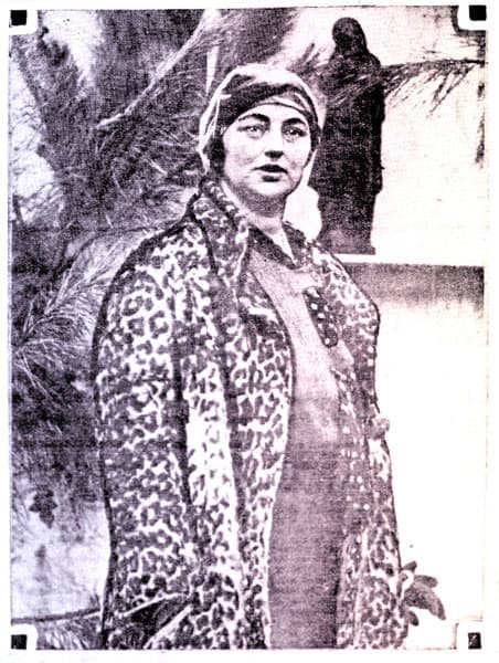 Princess Alexandra of Schleswig-Holstein wearing a leopard-print coat and matching turban.